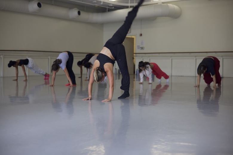 Dance students in mid-practice during a dance class